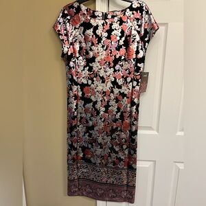 ECI New with Tags stunning body con dress. Black & metallic tone floral pattern